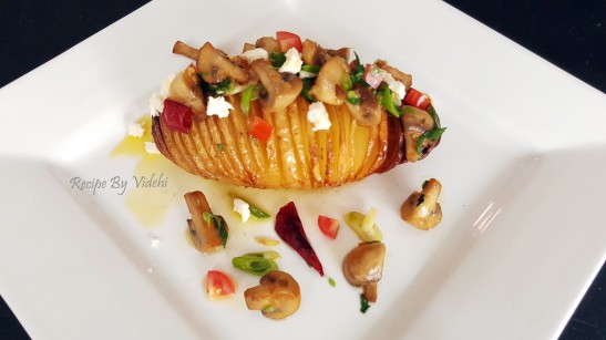 Hasselback Potatoes served with buttery garlicy mushrooms